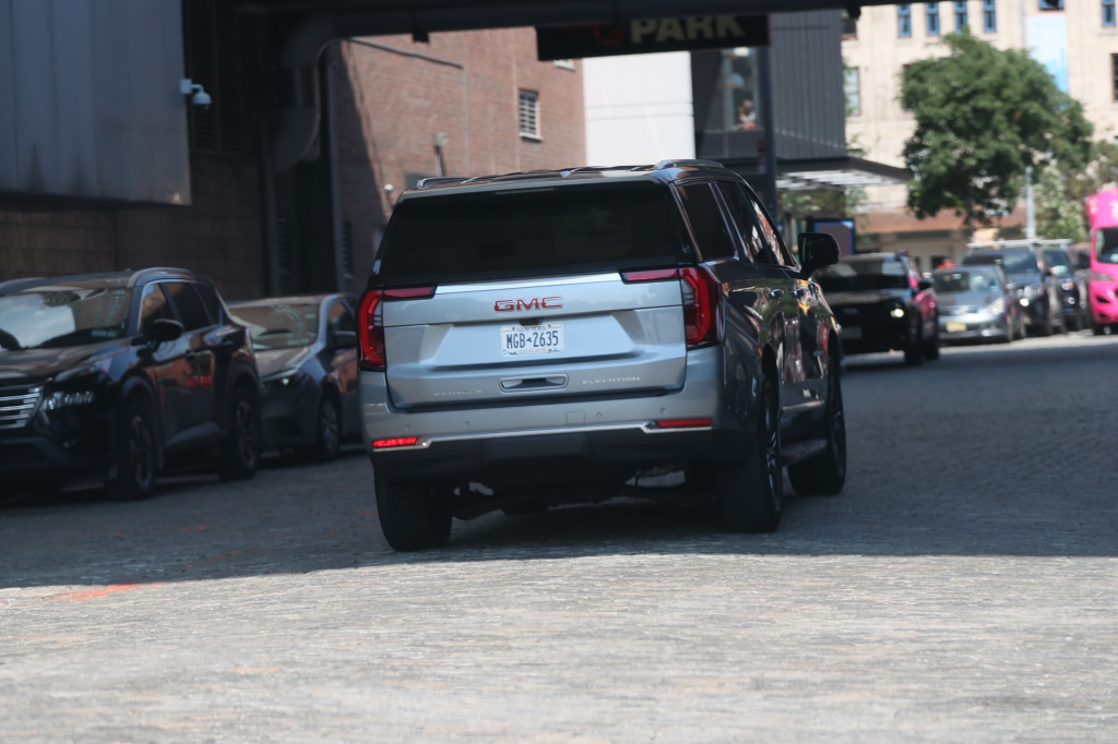 A gray GMC SUV with a New York license plate MGB-2635.