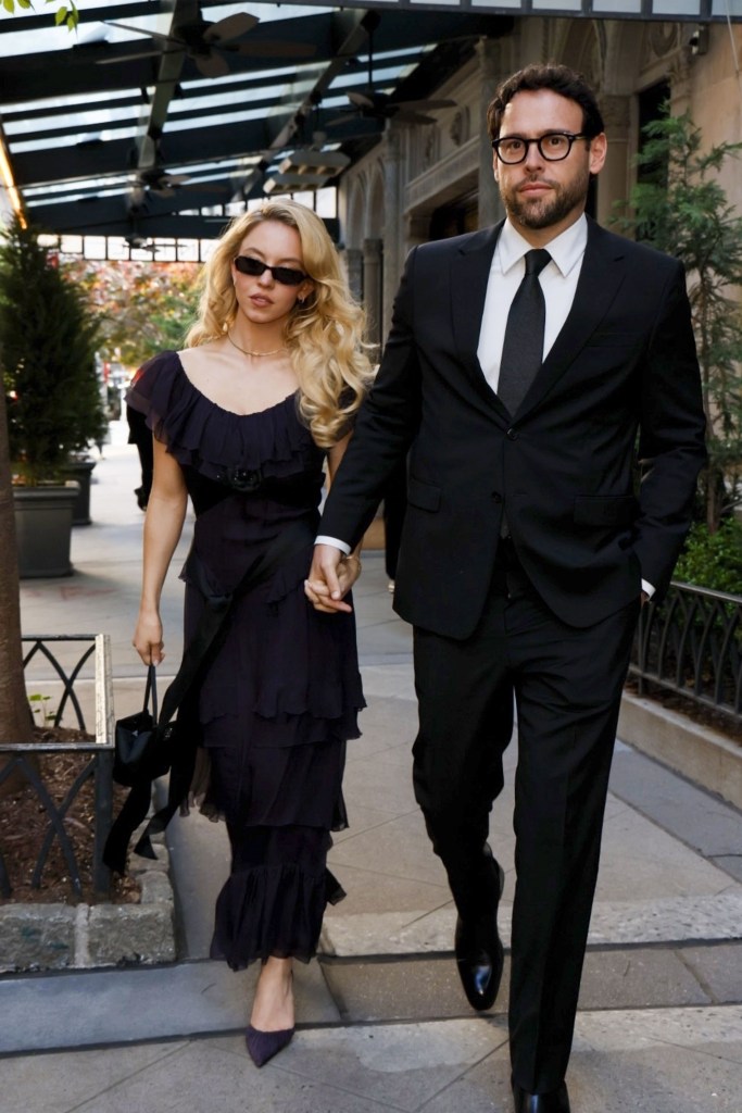 Sydney Sweeney and Scooter Braun walking hand-in-hand in New York City.