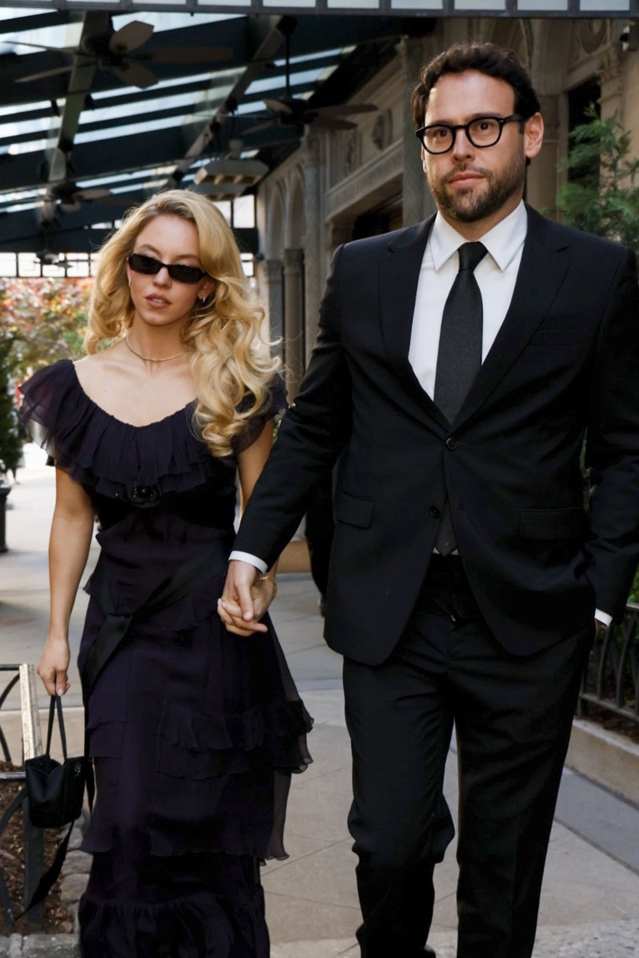 Sydney Sweeney and Scooter Braun walking hand-in-hand in New York City.