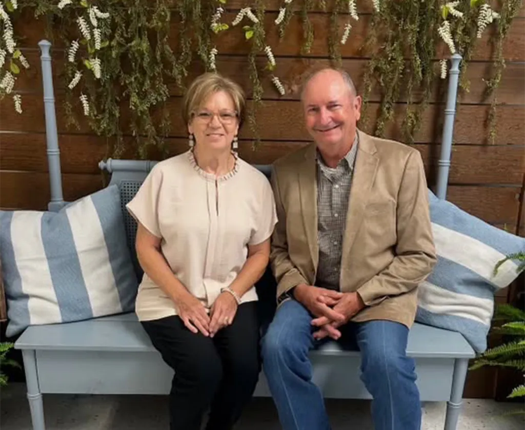 Billy Blair and his wife, Virginia Carol Blair, sitting on a bench.