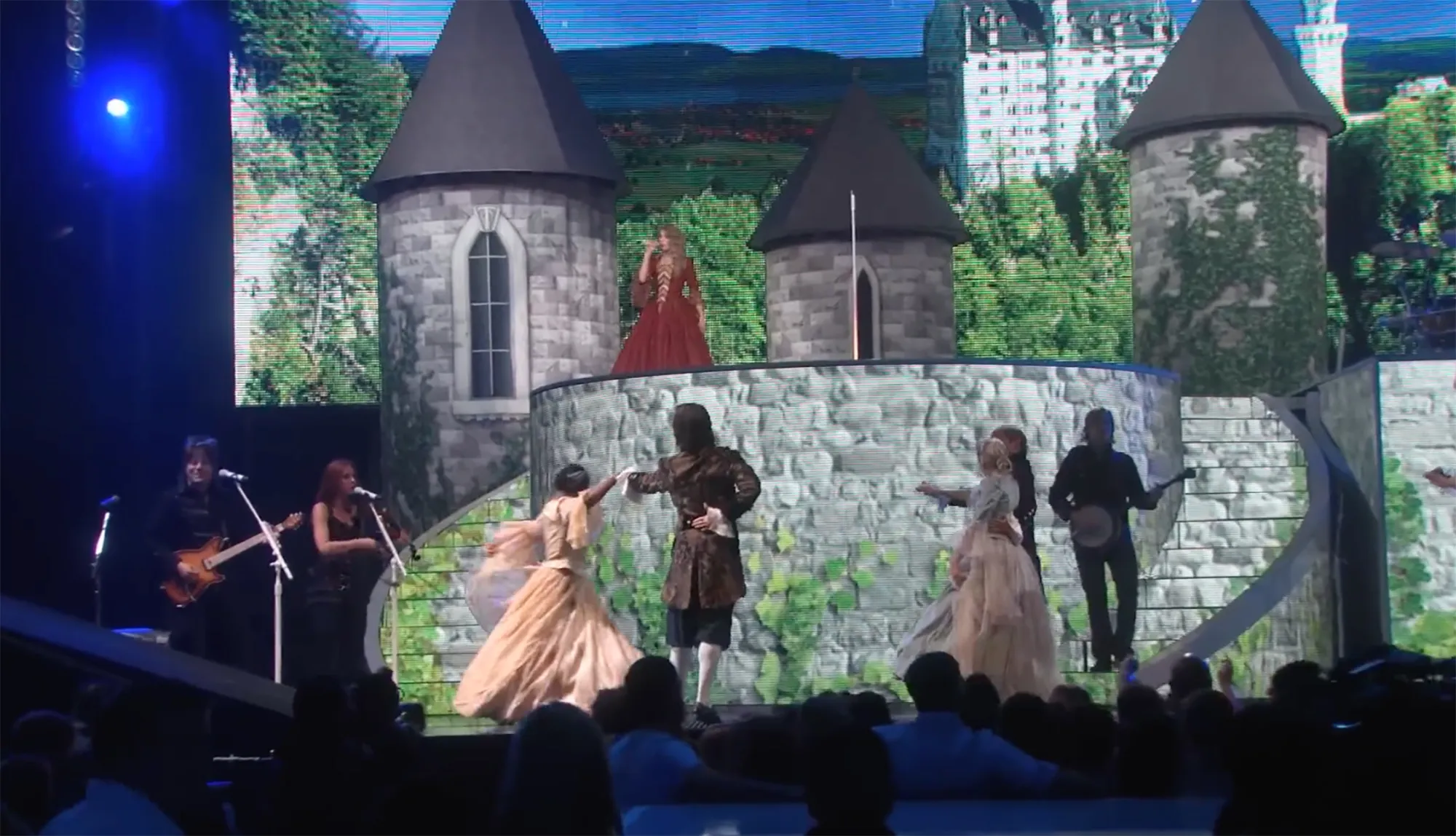 Taylor Swift performs on a castle-themed stage during the Fearless tour.