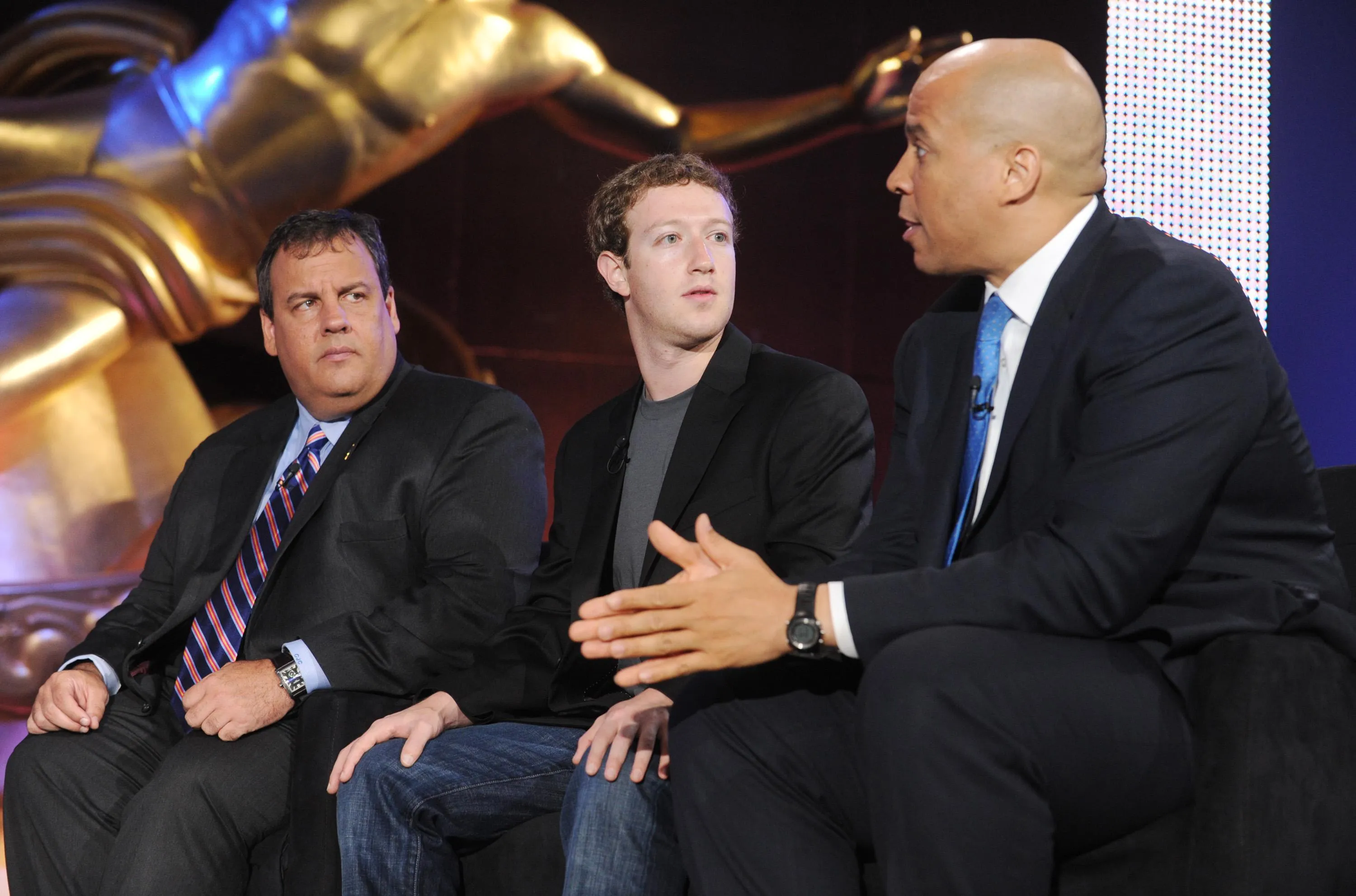 Mark Zuckerberg, Chris Christie, and Cory Booker sit and talk in Rockefeller Plaza Mark Zuckerberg, Chris Christie, and Cory Booker sit and talk in Rockefeller Plaza
