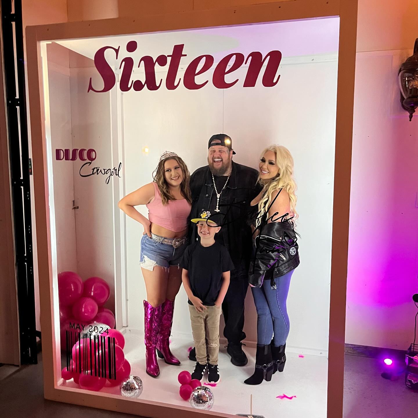 Bailee Ann, Jelly Roll, Bunnie XO, and a child pose in a photo booth with "Sixteen Disco Cowgirl" written above them.