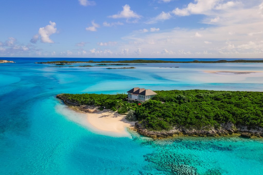 An aerial view of a luxurious private island in the Bahamas with a house on a secluded beach.The couple said “I do” on the isle in front of an intimate group of approximately 40 people that included Don Jr.’s five children, as well as his siblings Ivanka, Eric and Tiffany Trump, and their spouses.