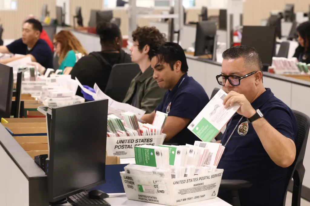 J. Robert Renner, Assistant United States Attorney, tours the election ballot processing center in City of Industry, California.