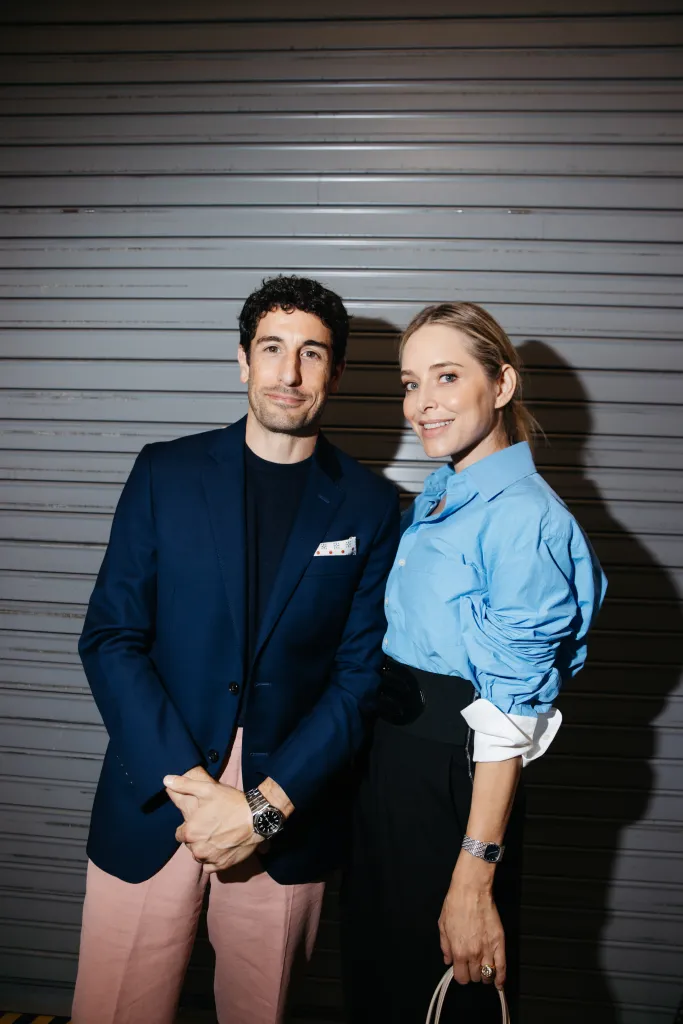 Jason Biggs and Jenny Mollen pose at the Monse fashion show.