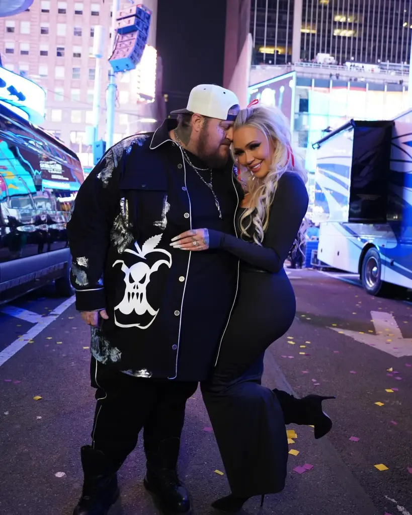 Jelly Roll and Bunnie XO hugging on a street.