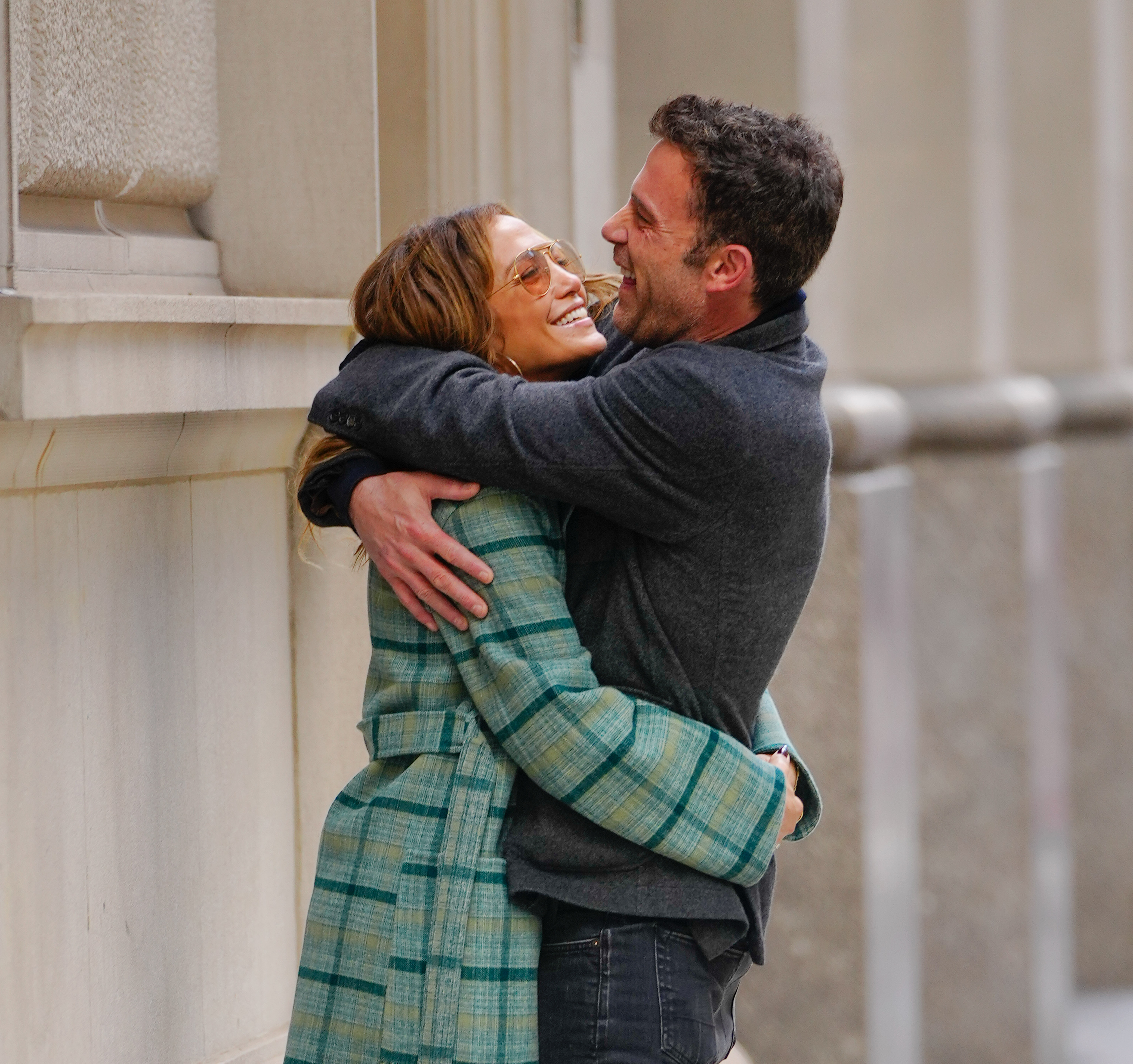 Jennifer Lopez and Ben Affleck embracing and laughing.