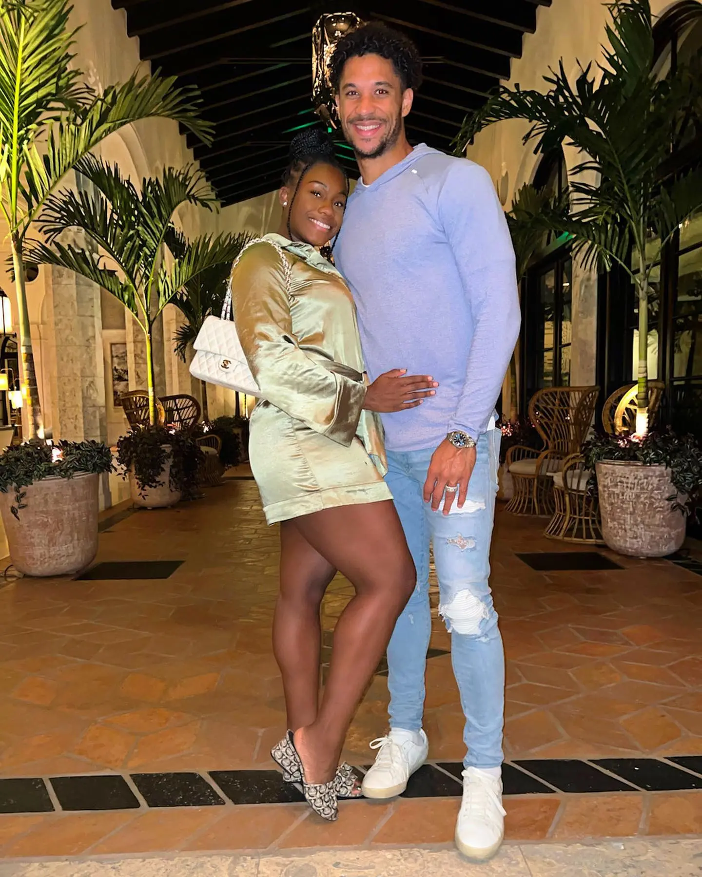 Josh Hart and Shannon posing outdoors.