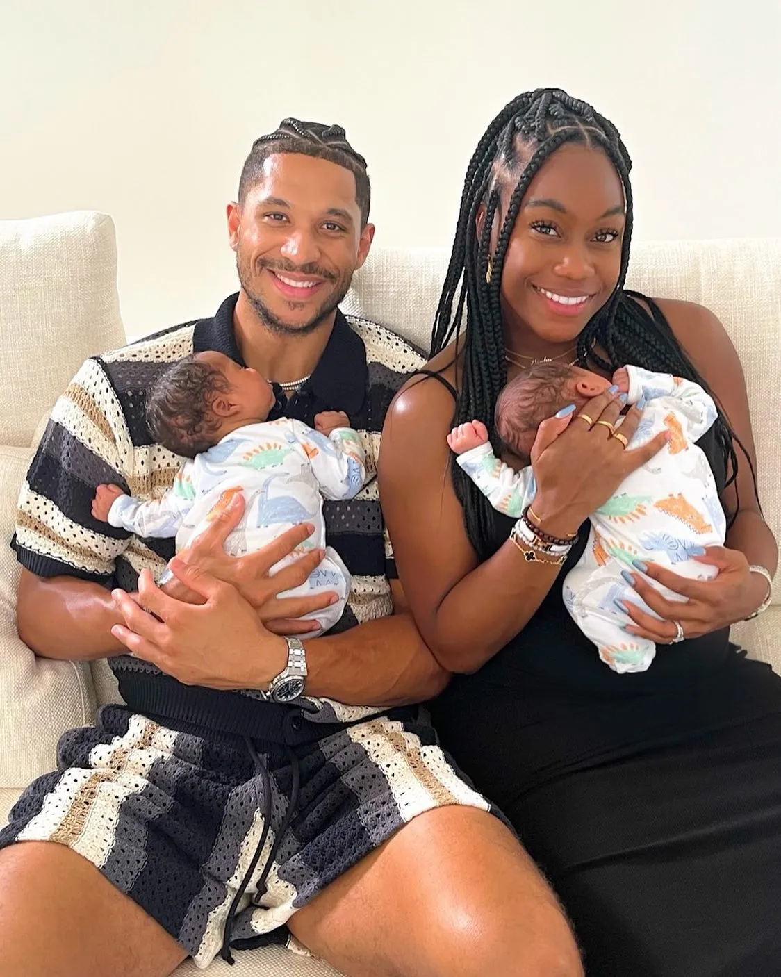 Josh Hart and Shannon holding their newborn twin babies.