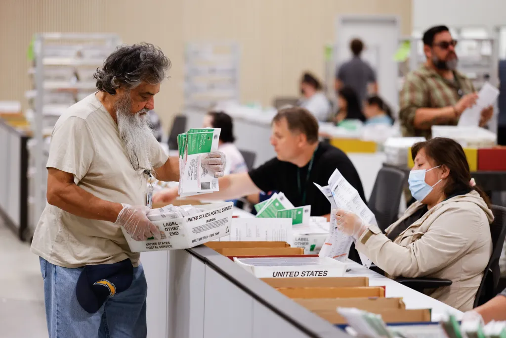 People counting ballots from the 2026 California Primary at the LA County Election Center.