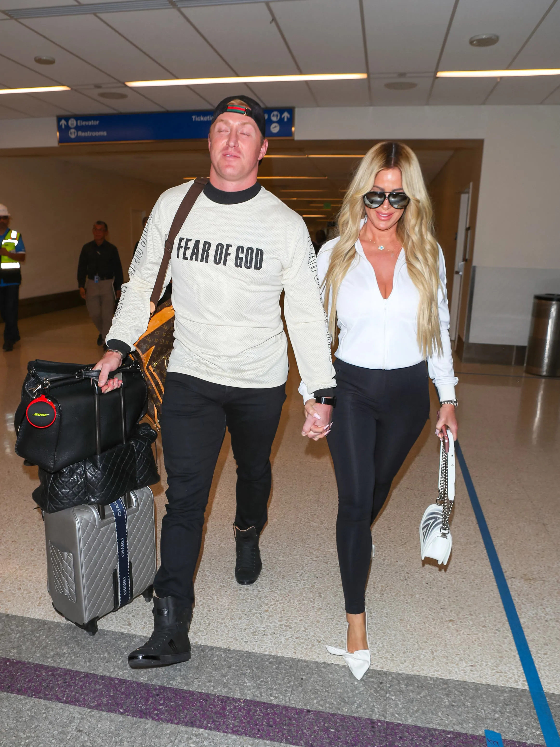 Kim Zolciak-Biermann and Kroy Biermann are seen at Los Angeles International Airport on March 08, 2018 in Los Angeles, California.