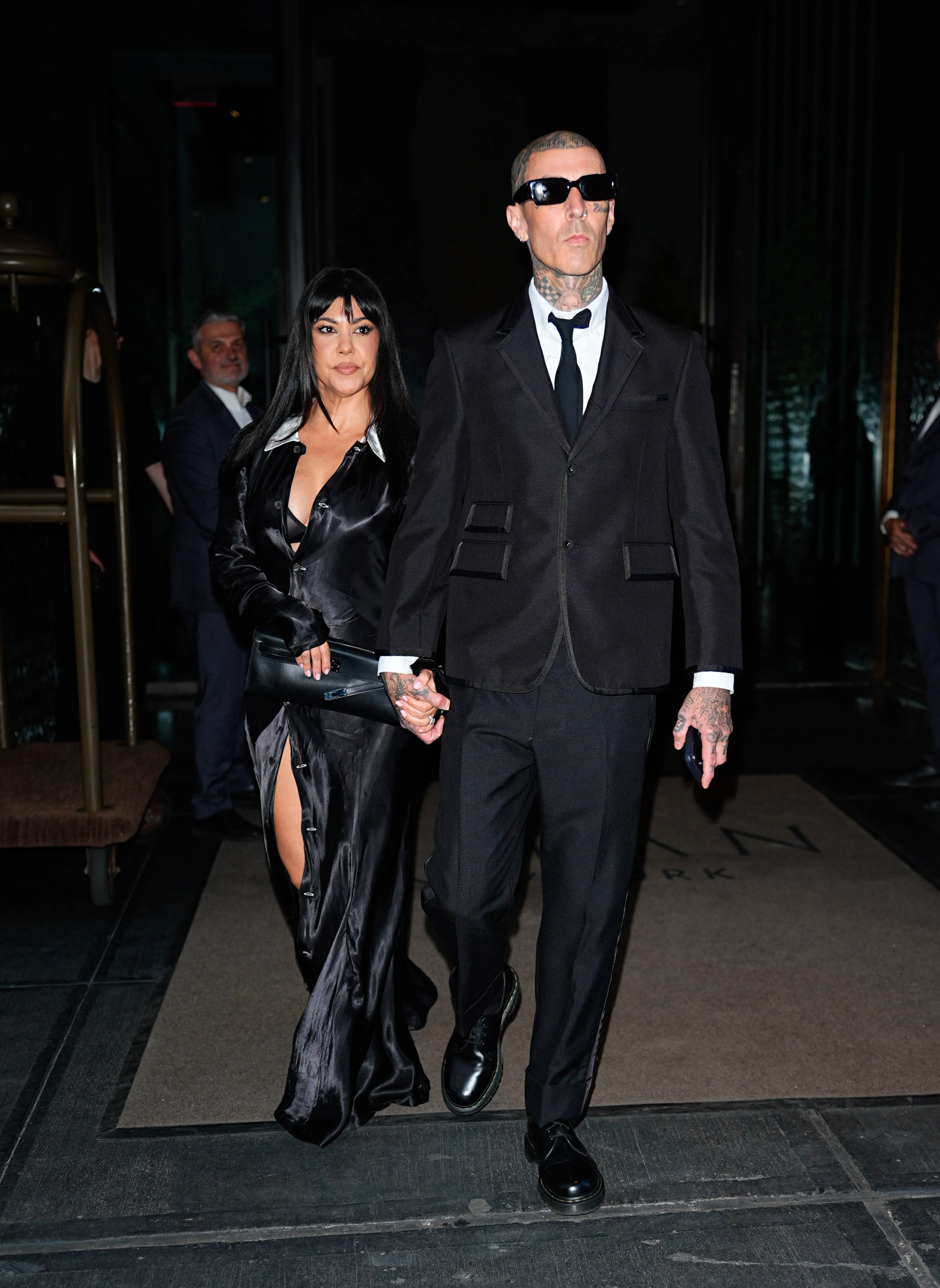 Kourtney Kardashian and Travis Barker holding hands in New York City.