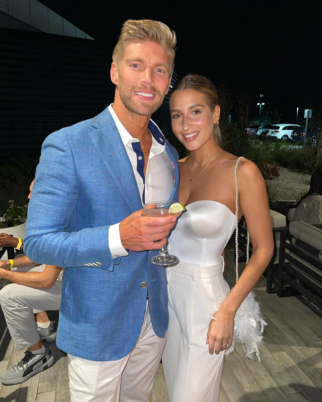Kyle Cooke and Amanda Batula smiling for a photo.