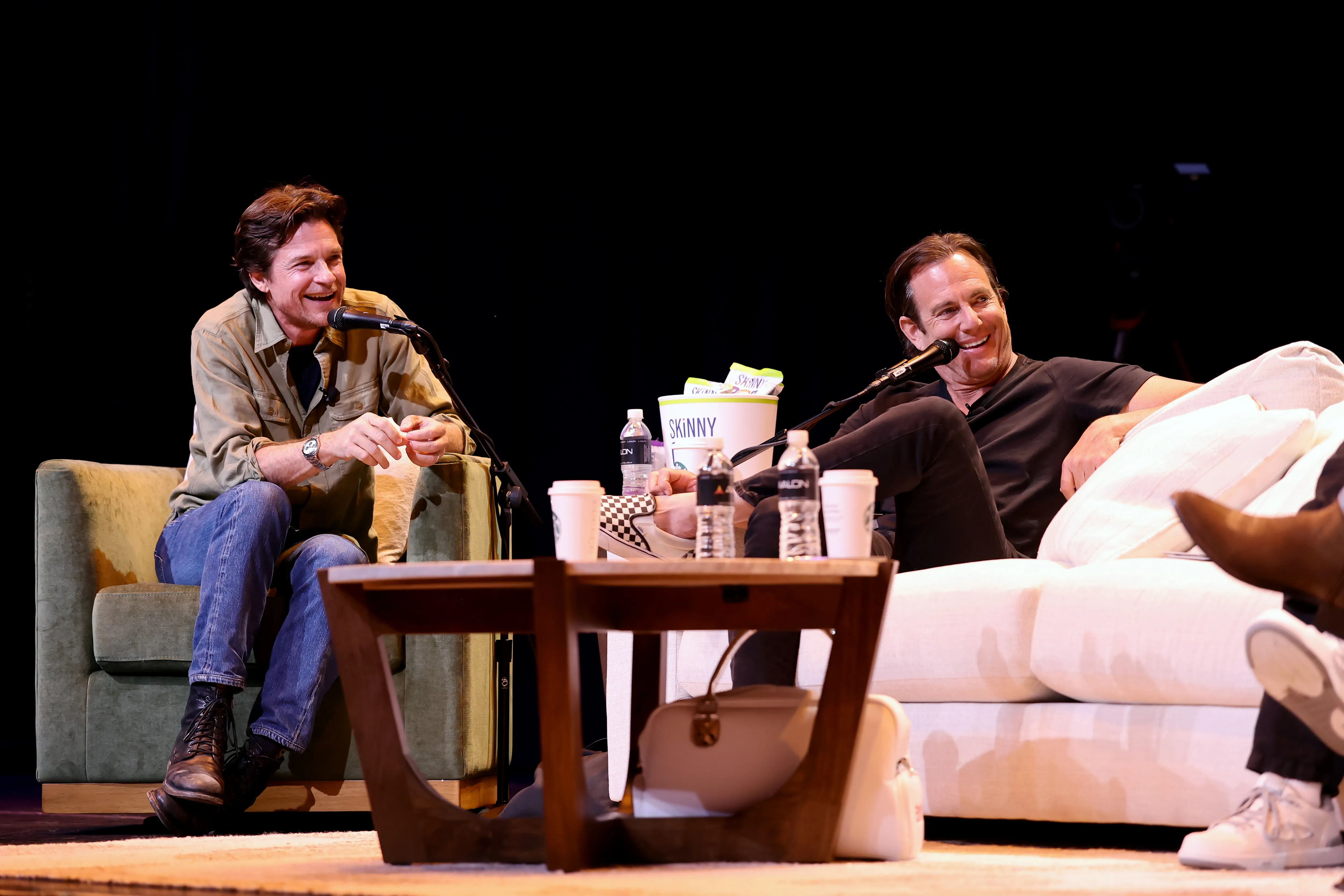 Jason Bateman and Will Arnett speaking onstage during SiriusXM Presents SmartLess Live with Special Guest John Mayer at AVALON Hollywood.