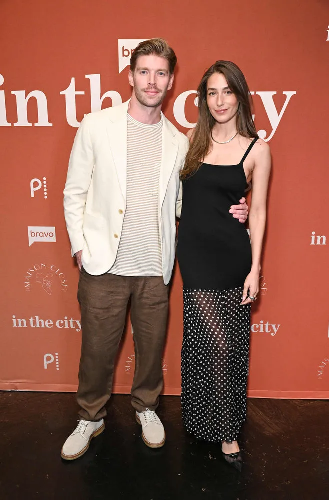 Kyle Cooke and Amanda Batula smiling at the "In The City" premiere party.