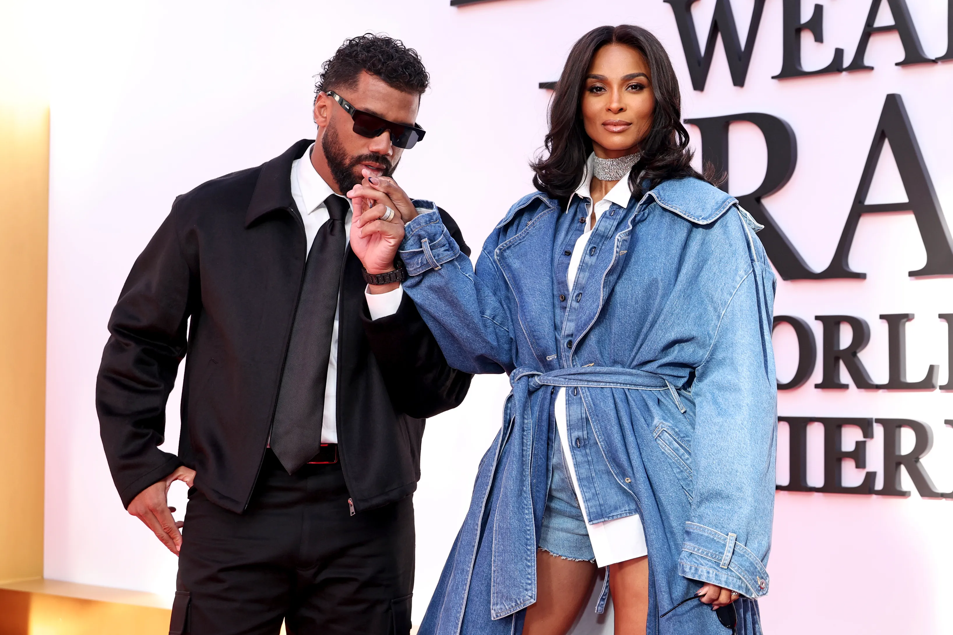 Russell Wilson kisses Ciara's hand at The Devil Wears Prada 2 world premiere.