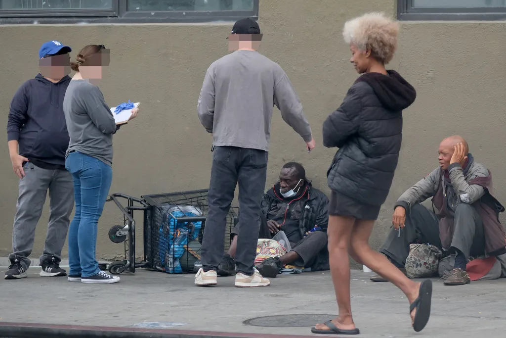 Plain clothes agents speaking to people on 5th and Towne Ave.