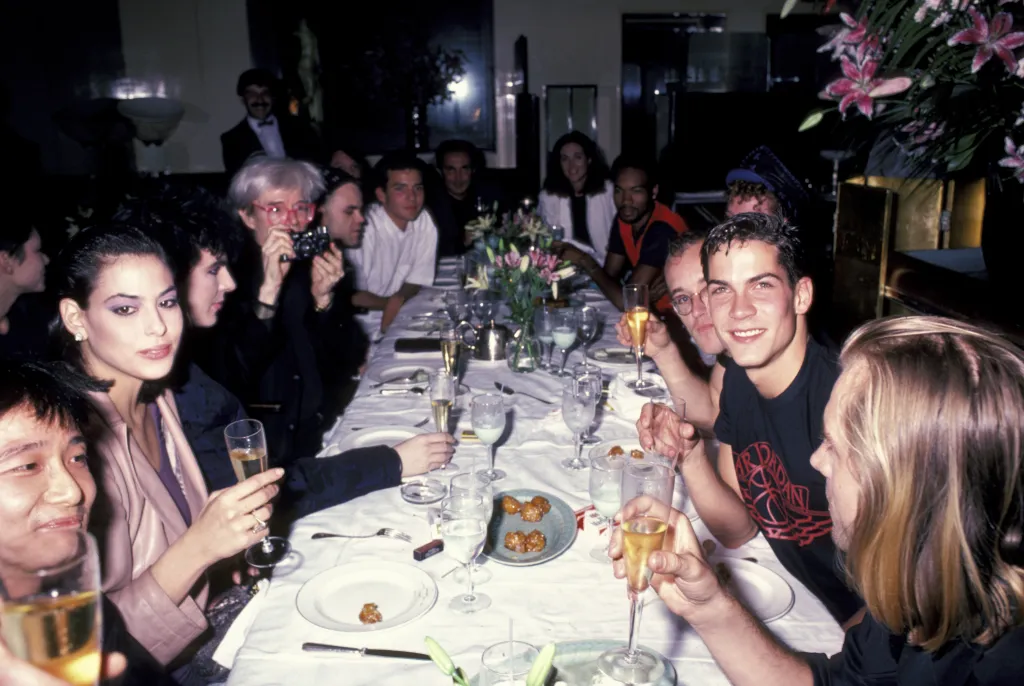 From left, restaurateur Michael Chow, Julie Anne Friedman, Pop musician Nick Rhodes, Pop artist Andy Warhol, and fashion designer Stephen Sprouse attend a birthday party.