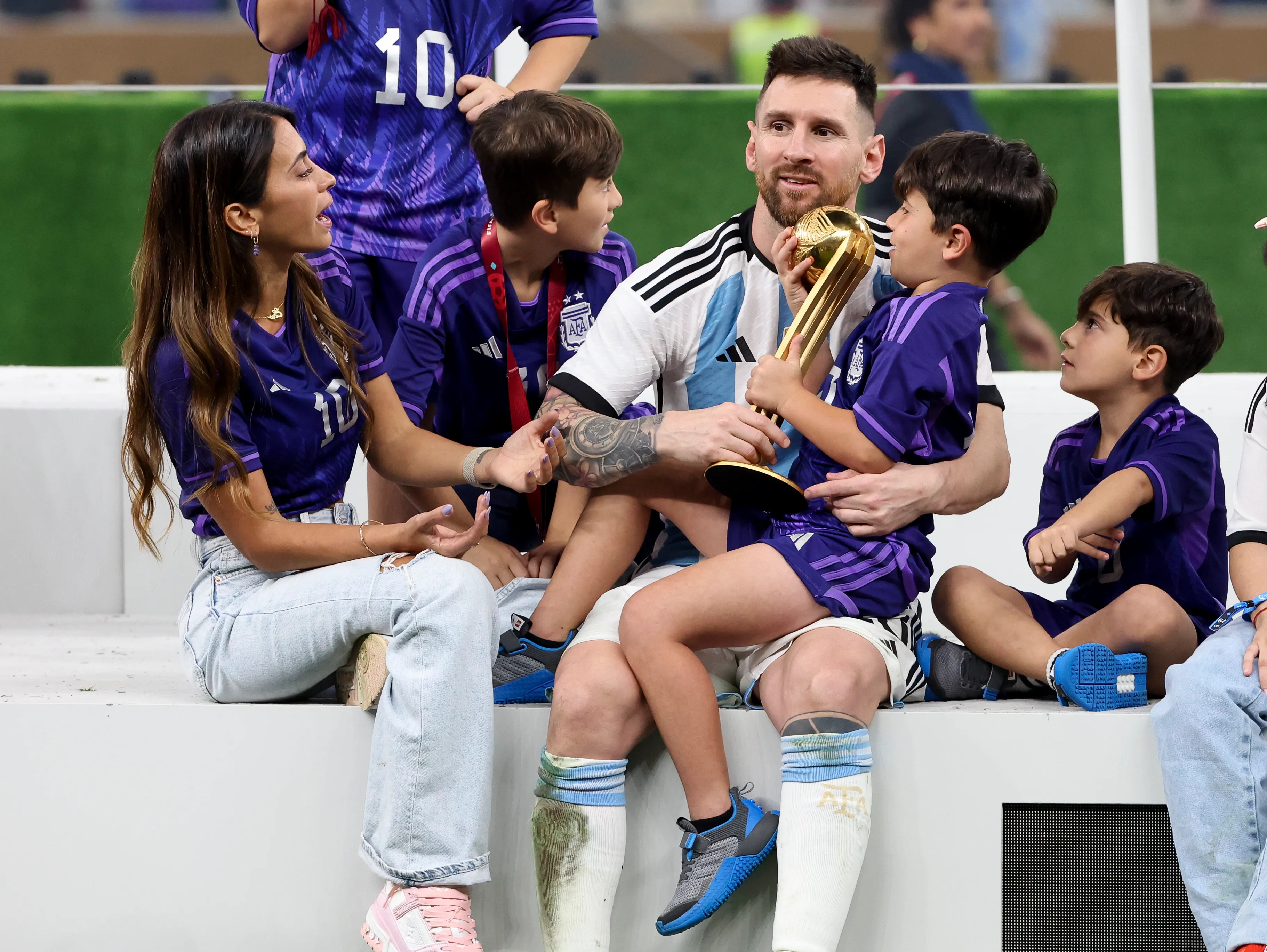 Lionel Messi celebrating the 2022 FIFA World Cup victory with his wife and children.