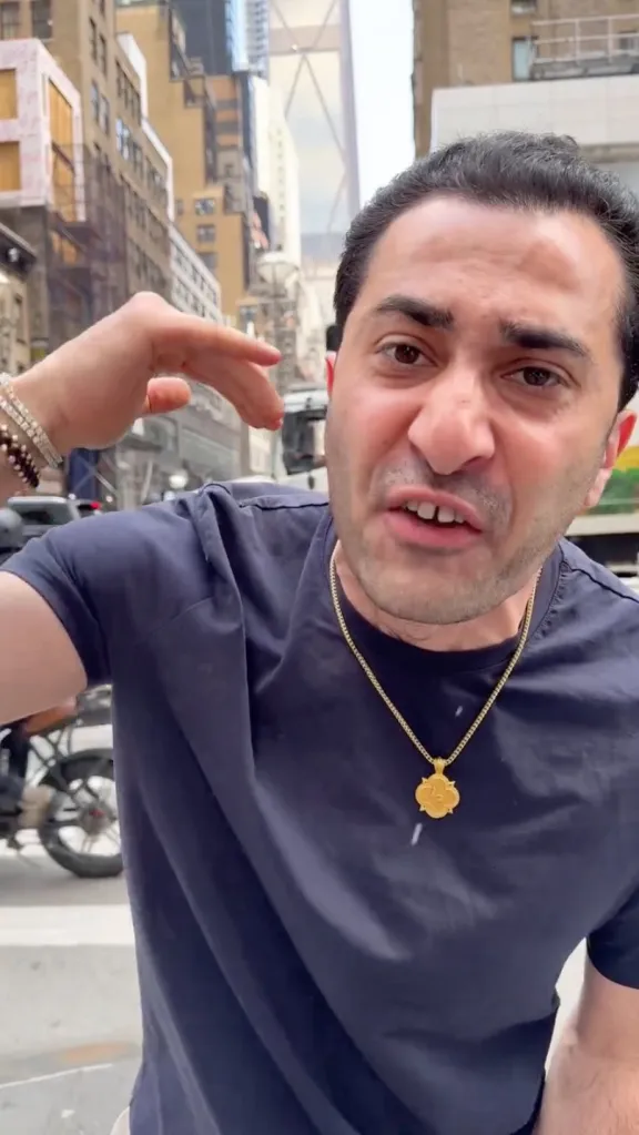 Maksud Agadjani, owner of TraxNYC jewelry, speaks while gesturing with his hand.