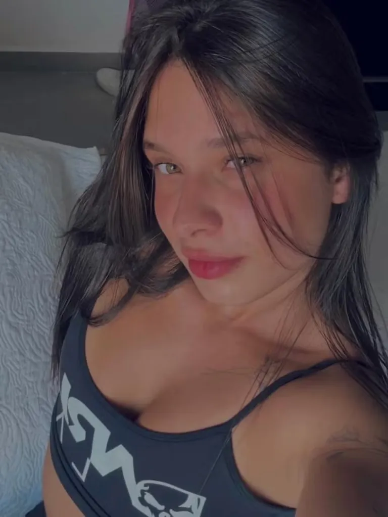 Maria Eduarda Rodrigues de Freitas, with dark hair and hazel eyes, wearing a black top.