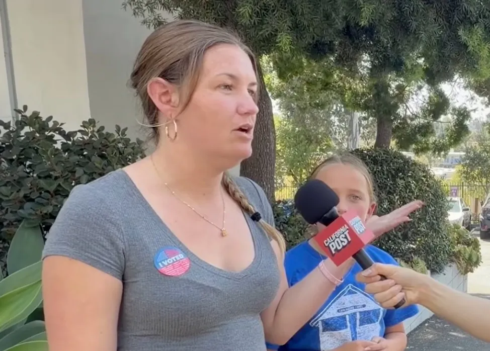 Marissa Abel, Pacific Palisades fire victim, being interviewed while wearing an "I Voted" sticker.
