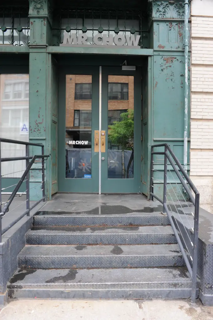 Exterior view of Mr. Chow restaurant with steps leading up to the entrance.