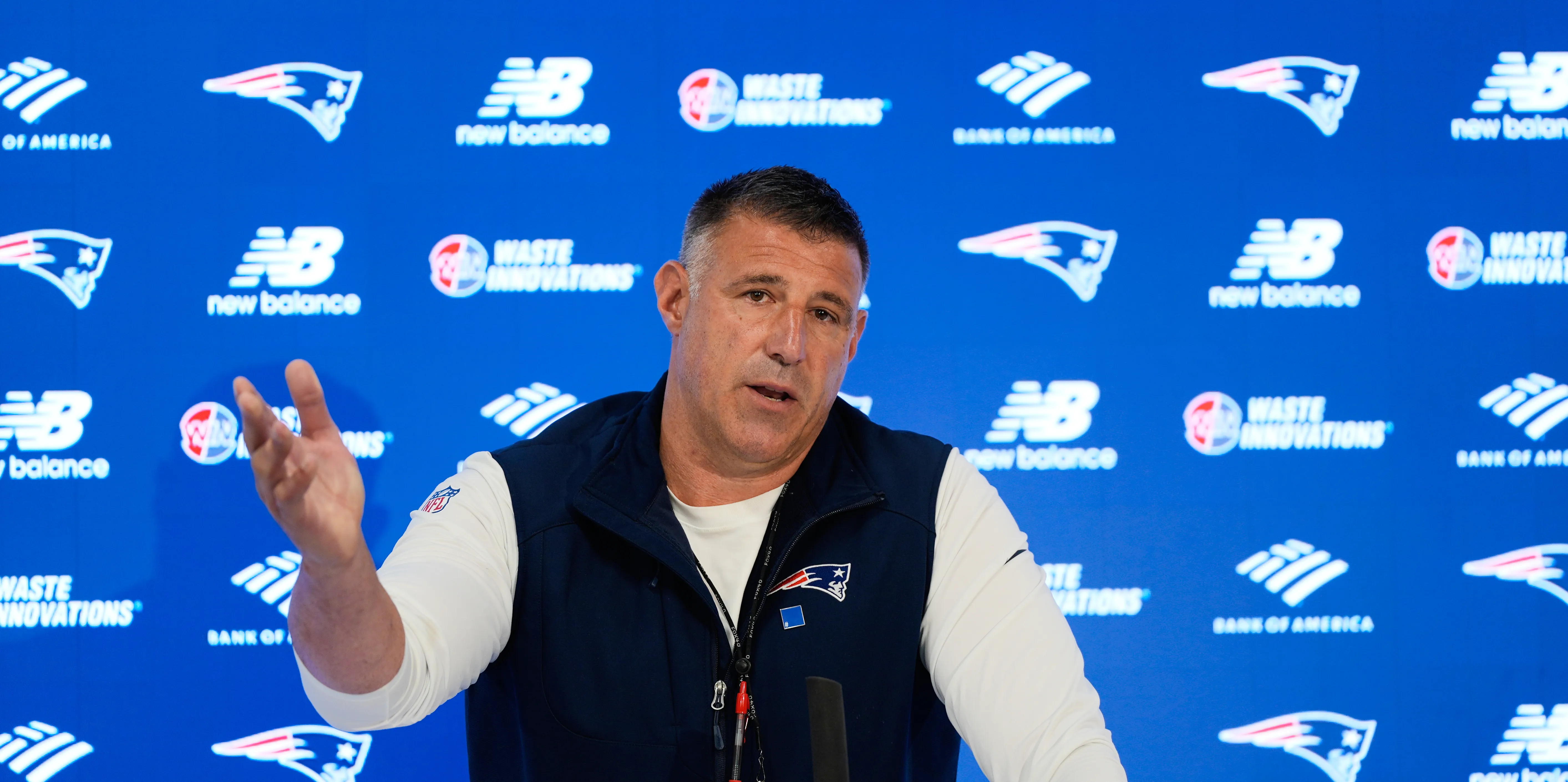 New England Patriots head coach Mike Vrabel talks with reporters.
