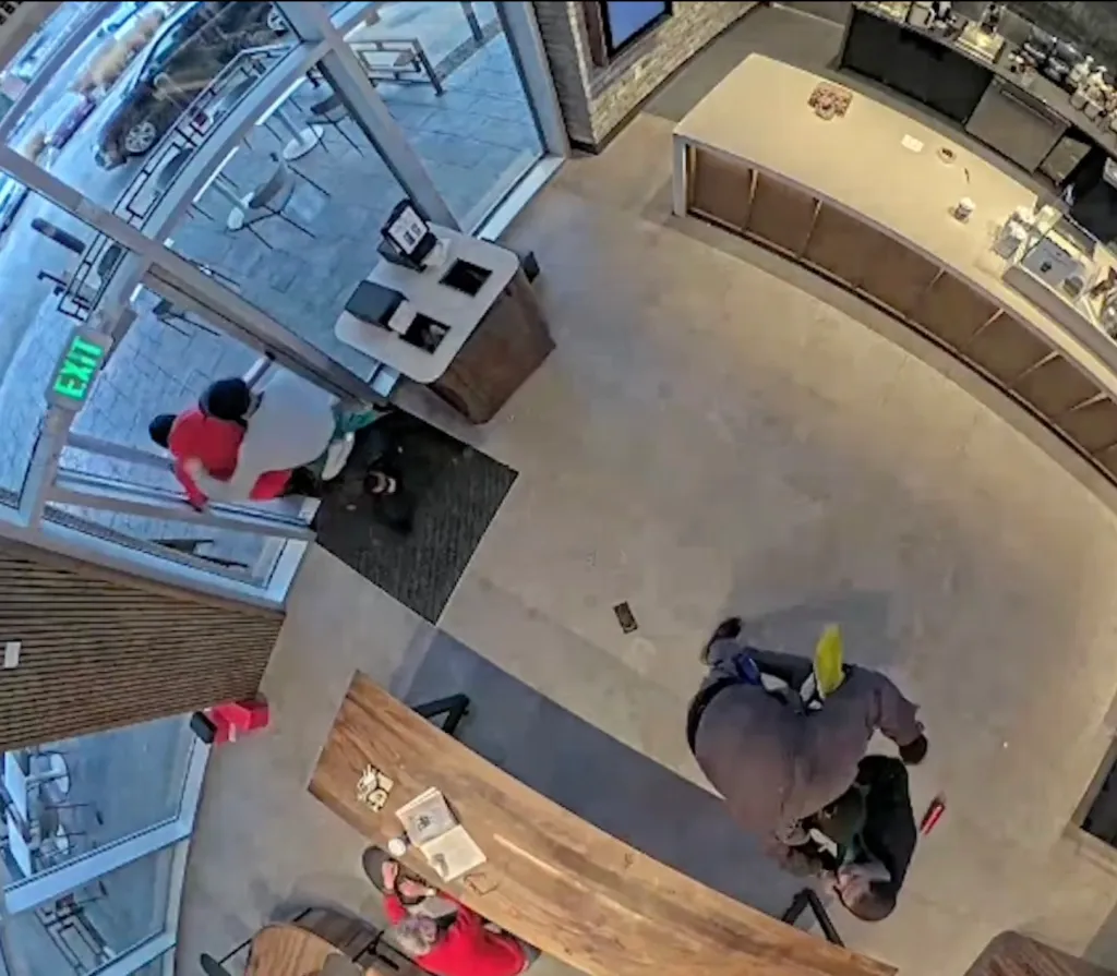 One of the robbers fled the store while Harris and his coworker held down the other until police arrived.