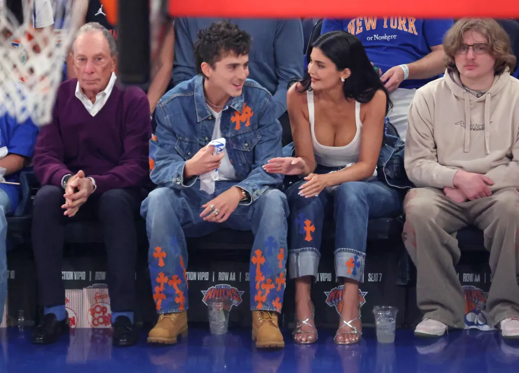Timothée Chalamet and Kylie Jenner on celebrity row with Michael Bloomberg during a New York Knicks vs. San Antonio Spurs NBA Finals game.