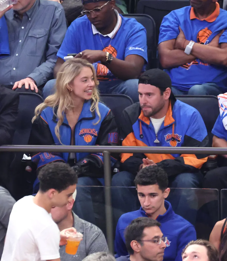 Actress Sydney Sweeney and boyfriend Scooter Braun sitting courtside at a New York Knicks vs. San Antonio Spurs game.