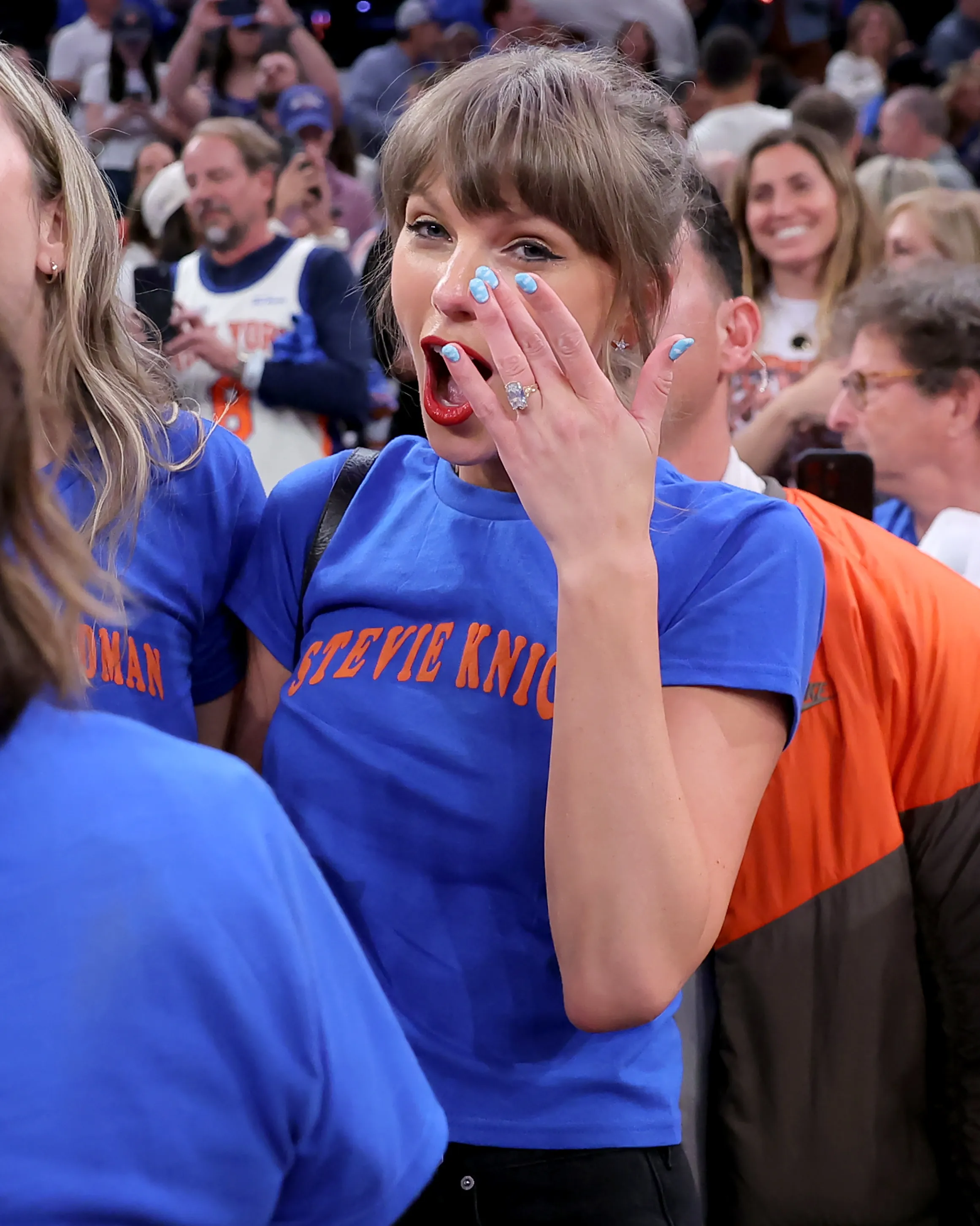 Taylor Swift cheering at an NBA Finals game.