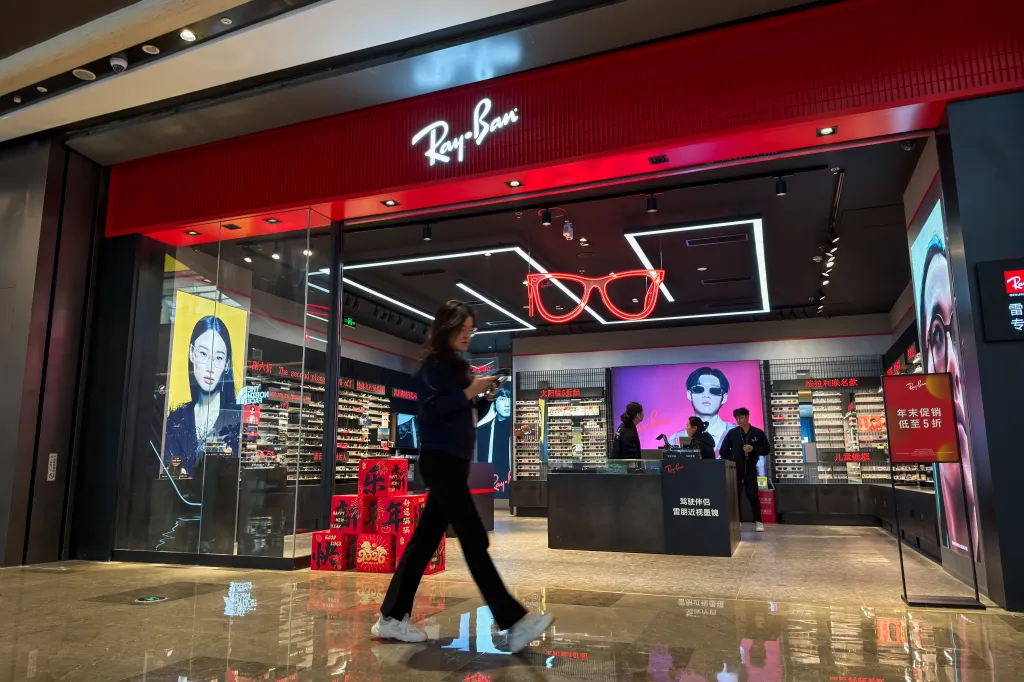 A shopper walks past a Ray-Ban store inside a shopping mall in Chongqing, China, on Jan. 16, 2026.