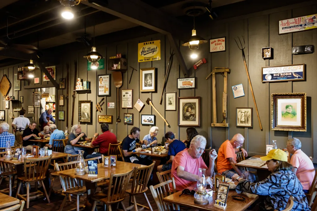 Customers dining inside a Cracker Barrel Country Store restaurant.
