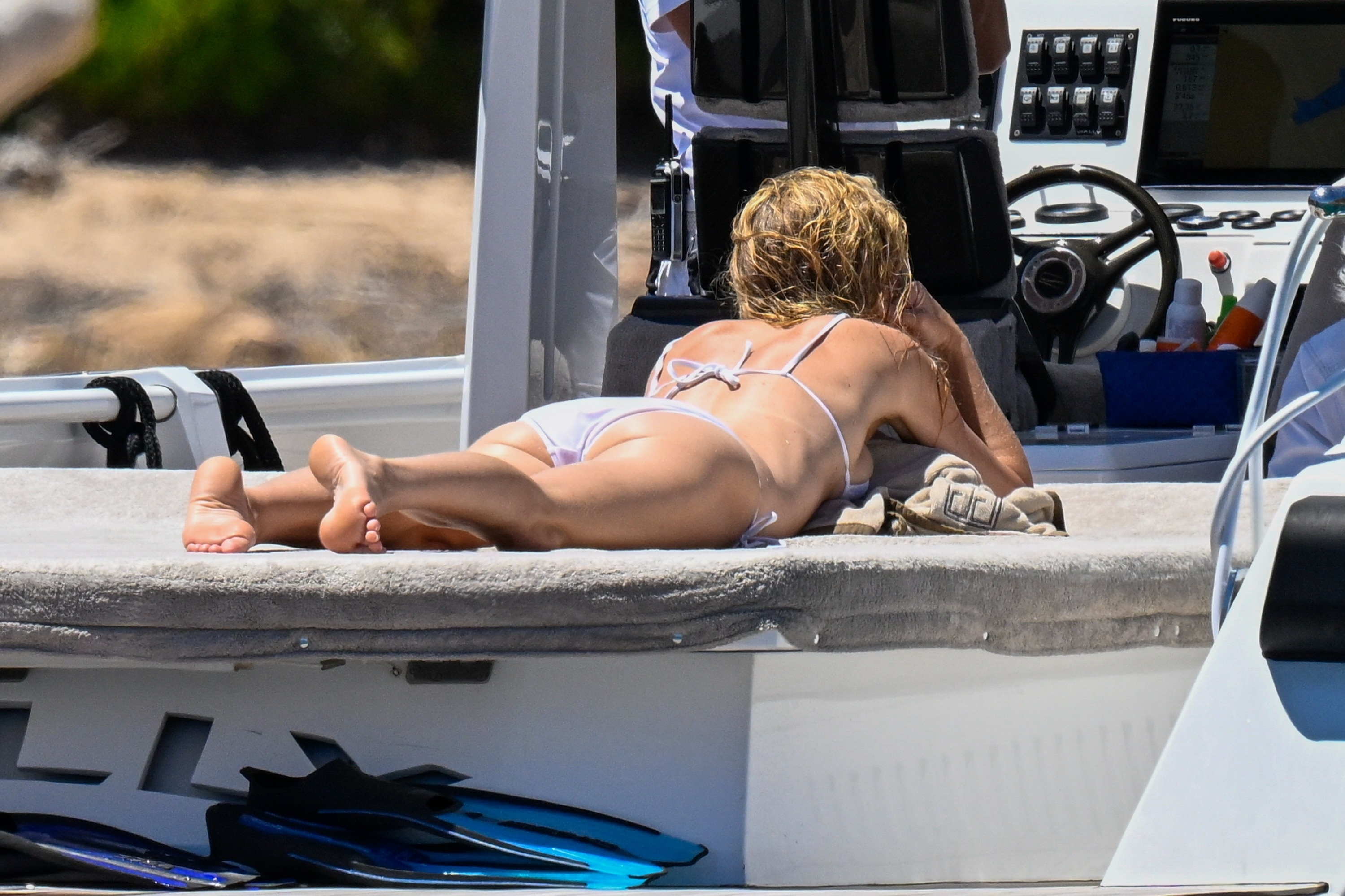 Gwyneth Paltrow sunbathing on a yacht.