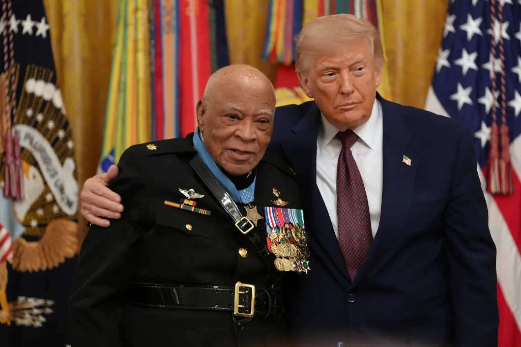 President Donald Trump posing with retired Marine Maj. James Capers after awarding Capers the Medal of Honor.