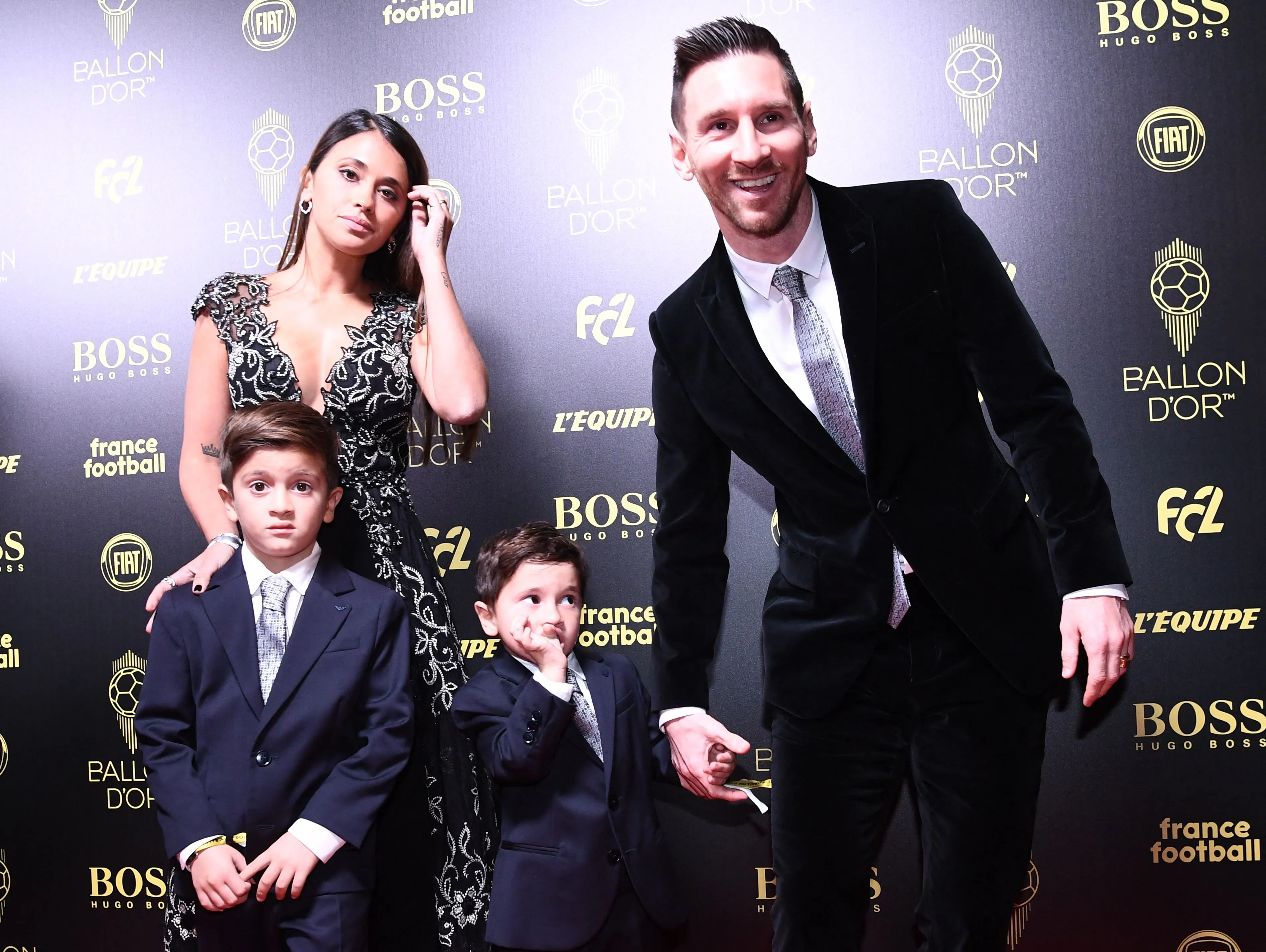 Lionel Messi and Antonella Roccuzzo pose with their two sons at the Ballon d'Or ceremony.
