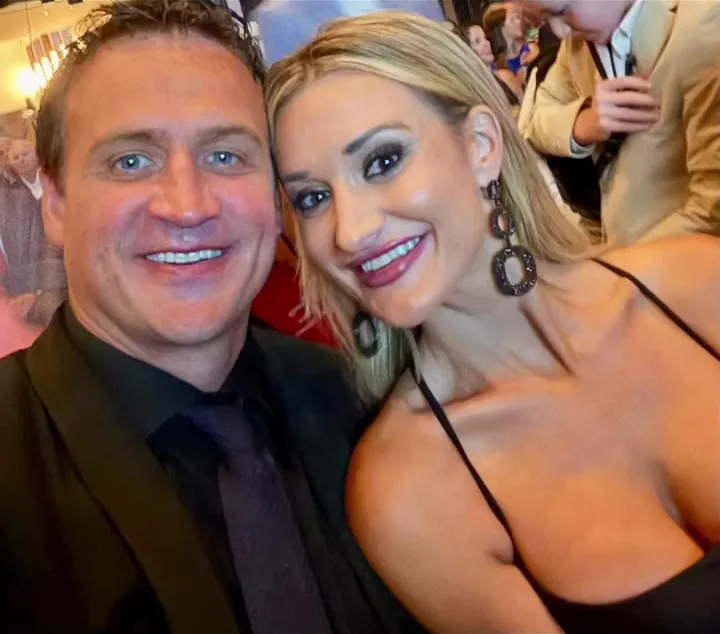 Ryan Lochte and Molly Gillihan smiling together.