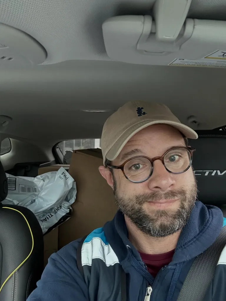 Danny Pintauro in an Amazon delivery vehicle.
