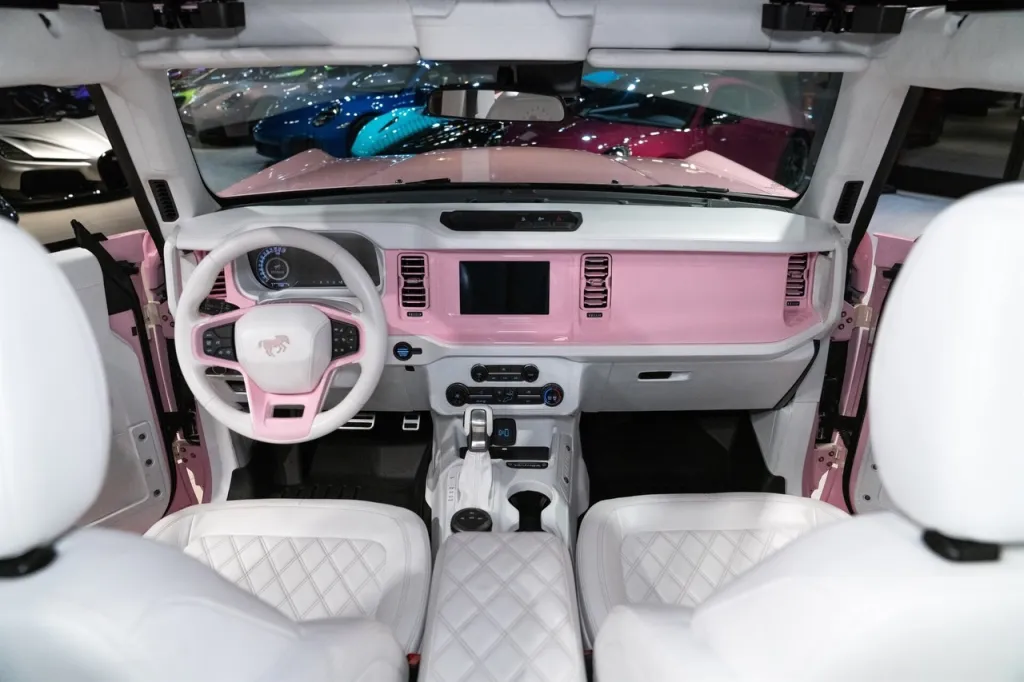 Interior of a pink Ford Bronco.