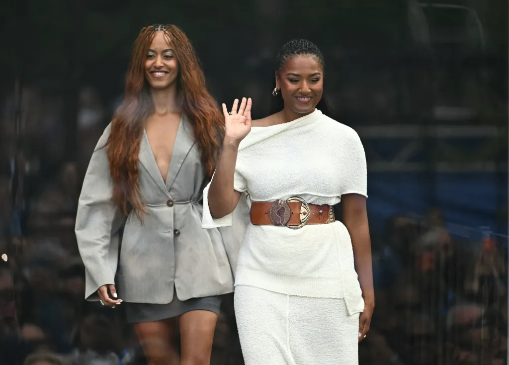 Malia and Sasha Obama arriving at the opening of the Barack Obama Presidential Center.