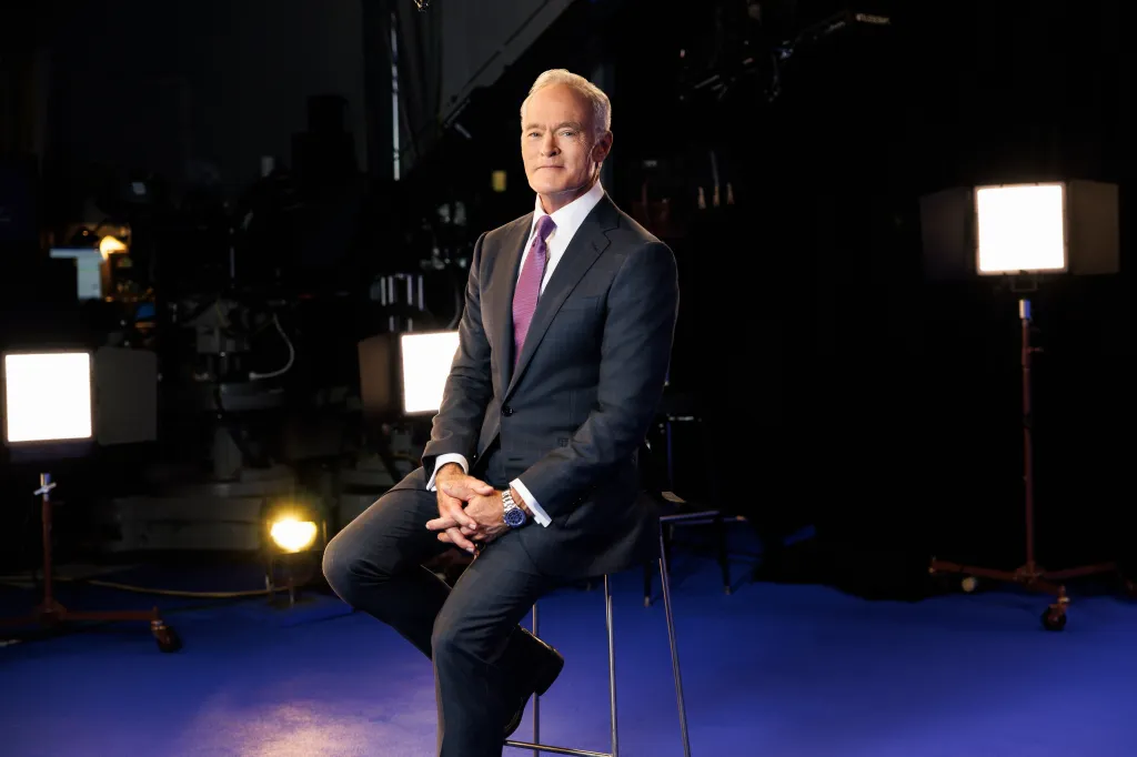Scott Pelley, Correspondent for 60 MINUTES, sits in a studio.