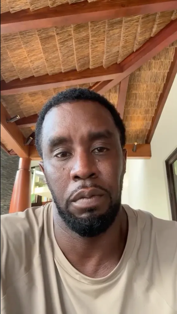 Sean "Diddy" Combs looks directly at the camera with a somber expression.