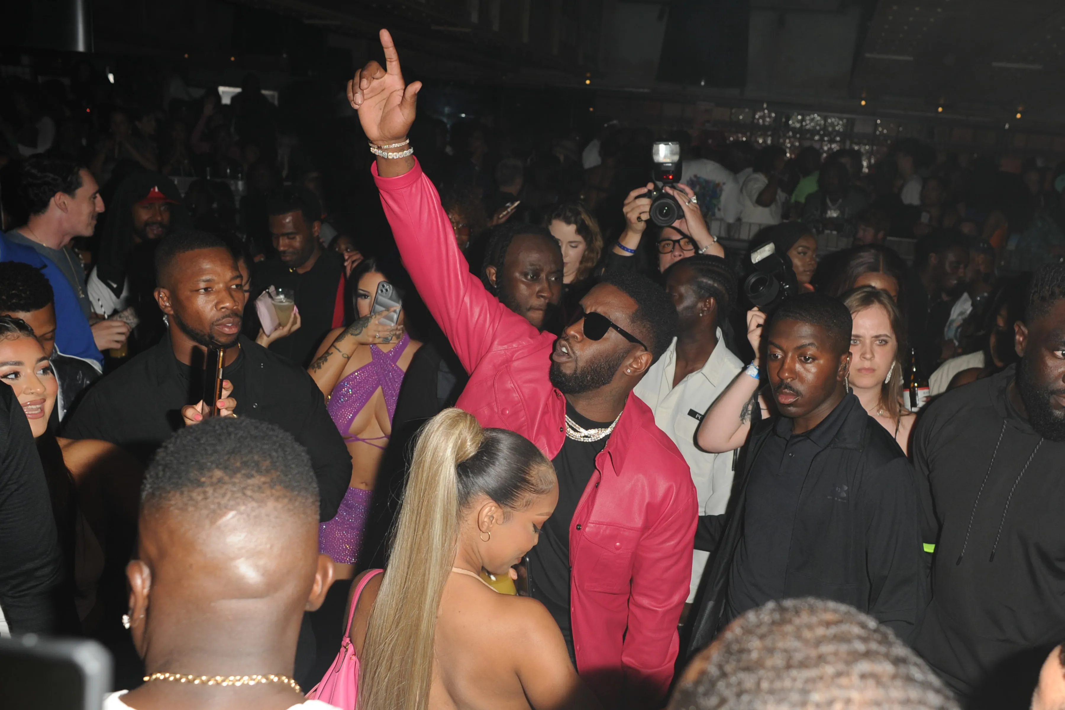 Sean "Diddy" Combs performing on stage at the Under the Bridge venue in London.