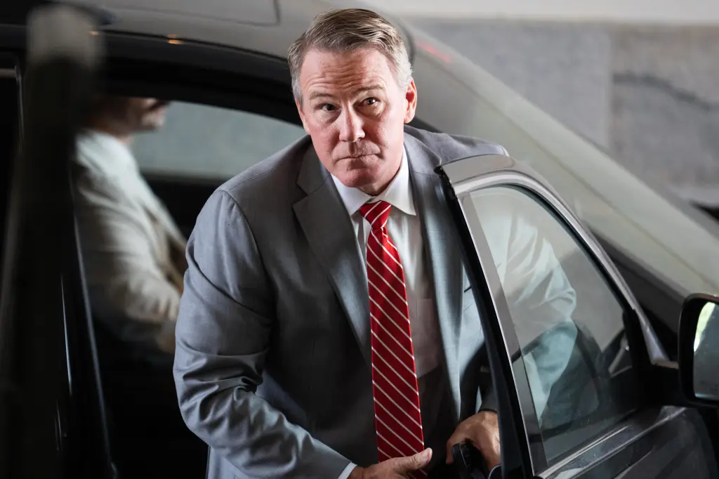 Sen. Jon Husted, R-Ohio, getting out of a car.