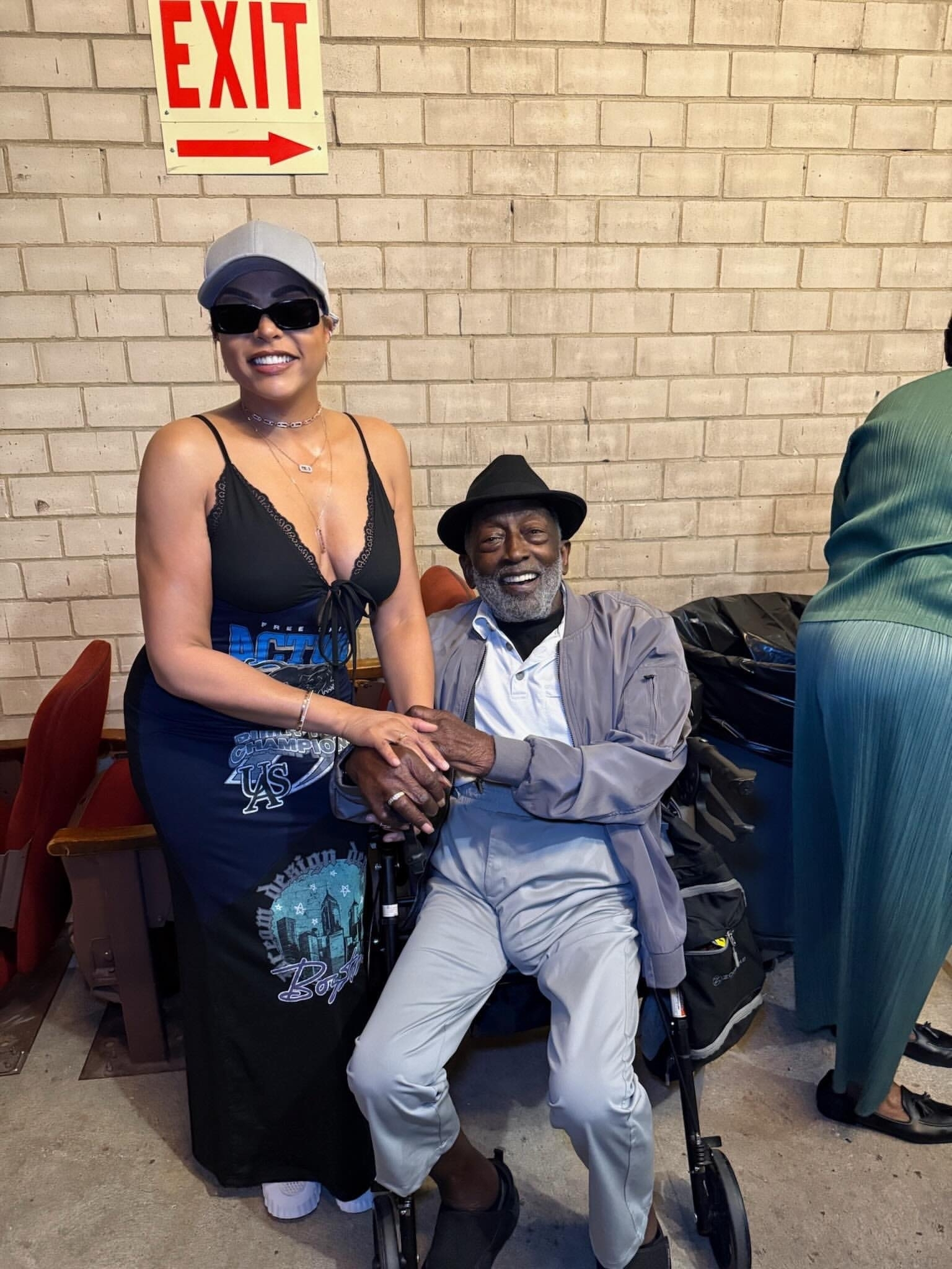 Garrett Morris and a woman posing for a photo.
