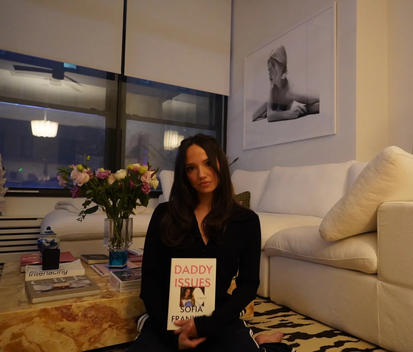 Sofia Frankyn holding her book "Daddy Issues".