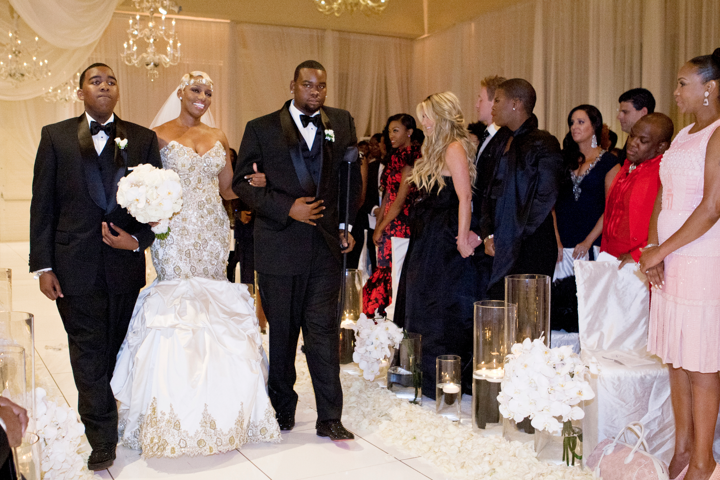 NeNe Leakes and her two sons, Brentt and Bryson, walking down the aisle at her wedding.