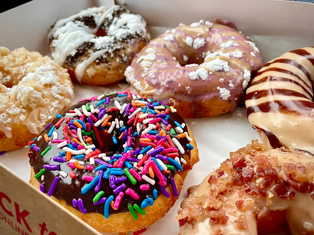 A box filled with different kinds of donuts.